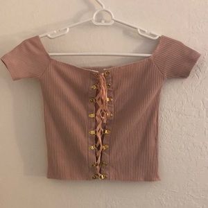 pink, lace up shirt with gold details